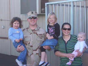 Jonathan Hartt, T1/E-6 of the U.S. Navy with his family