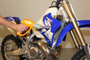 First, prep your bike's plastic by removing old stickers and thoroughly cleaning the surfaces.