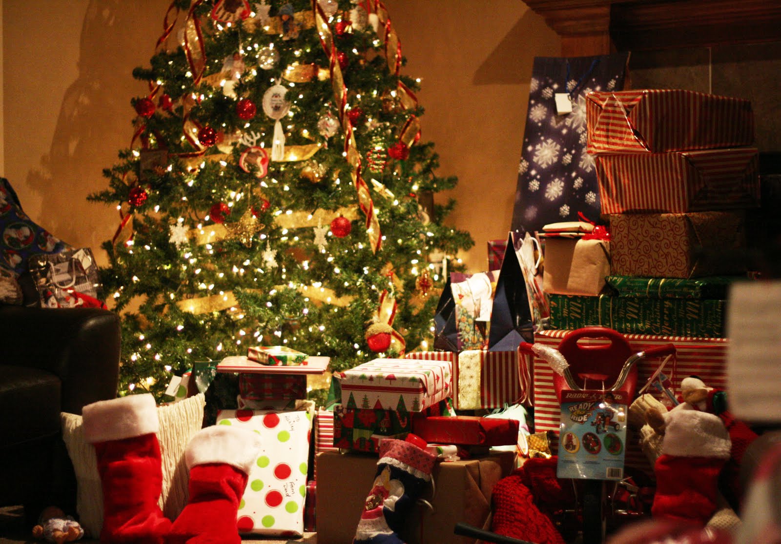 lots of christmas presents under tree